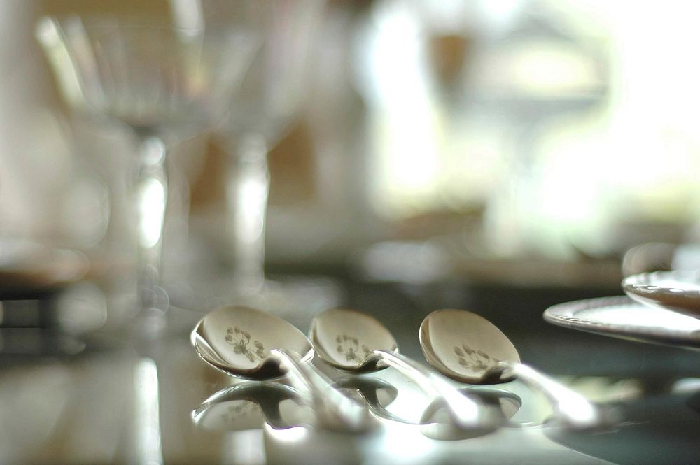 Silver cutlery on a dining table. Free public domain CC0 photo