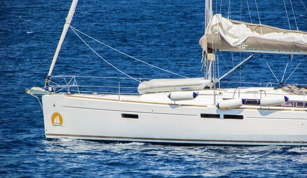 Yacht sailing in the sea. Free public domain CC0 photo.