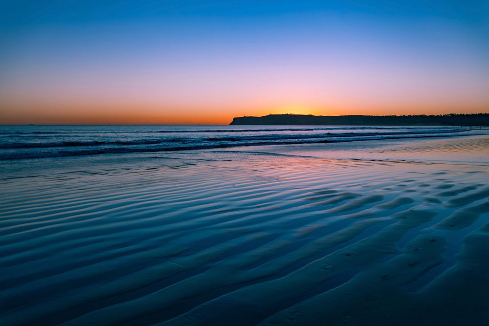 Beach sunset pastel color sky, free public domain CC0 photo.