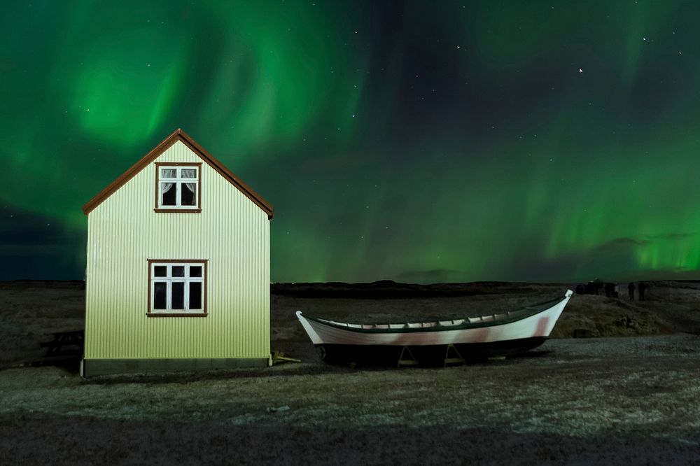 Free Norwegian house under aurora borealis, public domain shelter CC0 photo. 