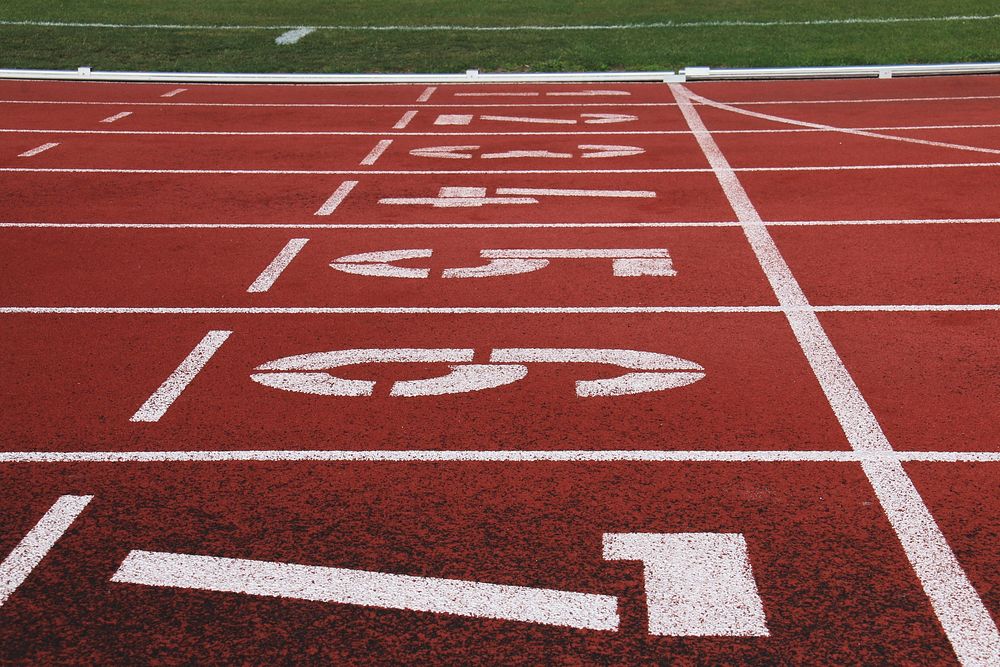 Free close up texture of running track surface with numbers photo, public domain sport CC0 image.