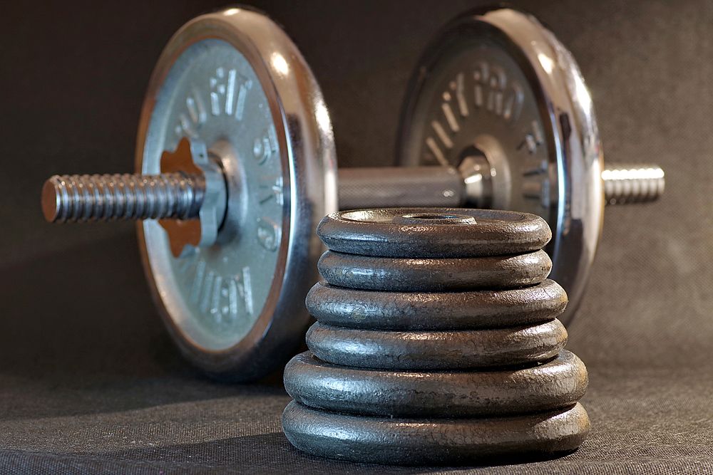 Free gym dumbbell on floor photo, public domain fitness CC0 image.