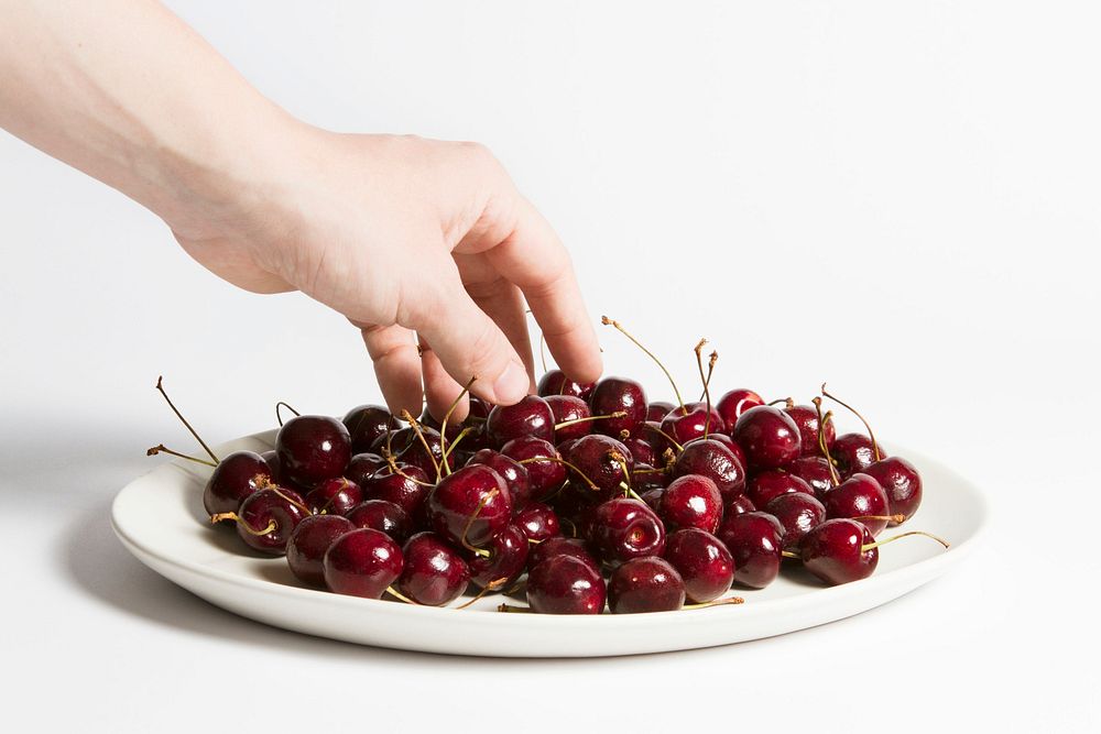 Free hand taking cherries image, public domain fruit CC0 photo.