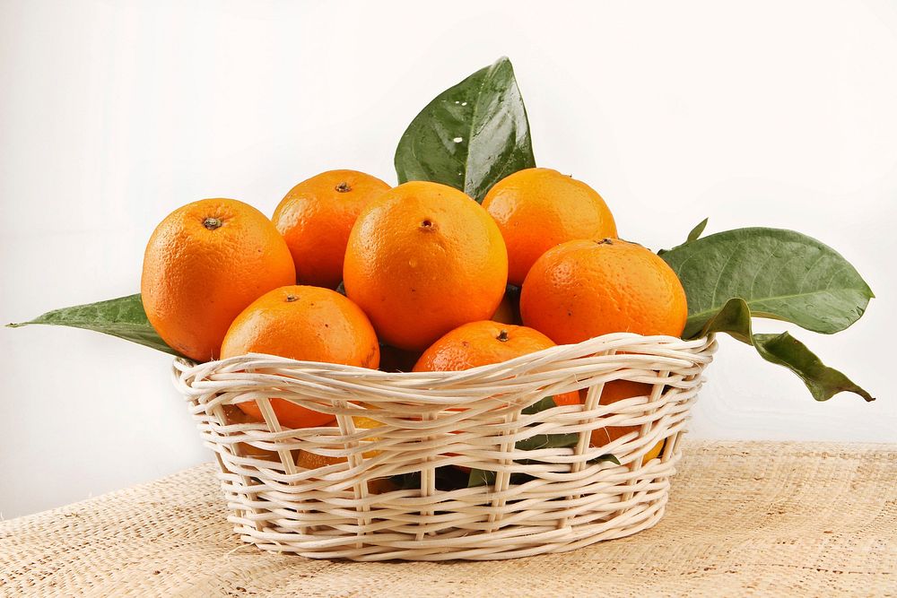 Free orange in basket image, public domain fruit CC0 photo.