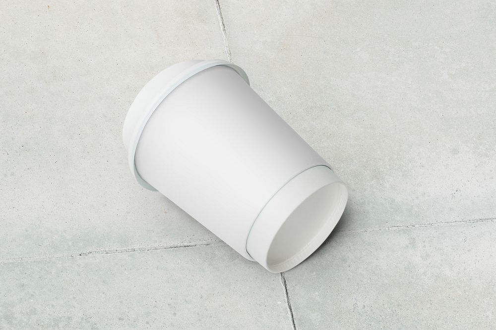 Blank paper cup on the ground 