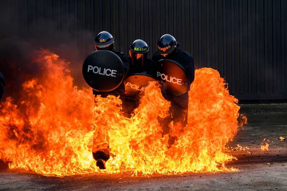 Free police officers face firefight in training photo, public domain CC0 image.