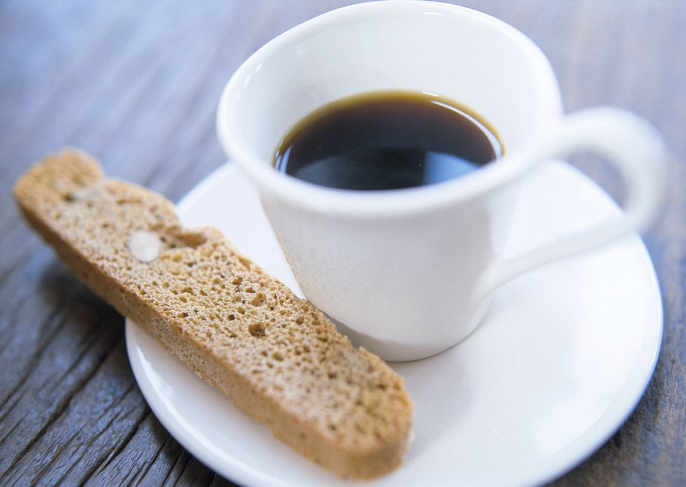 Free bread stick on wooden floor with coffee image, public domain food & beverage CC0 photo.