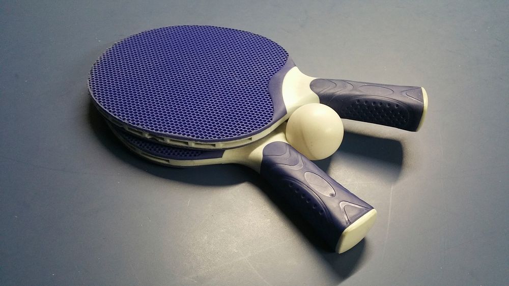Free table tennis paddle and ping pong ball image, public domain sport CC0 photo.