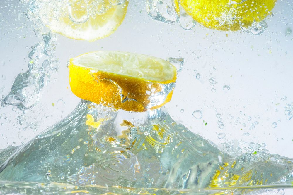 Free lemon splash closeup image, public domain beverage CC0 photo.
