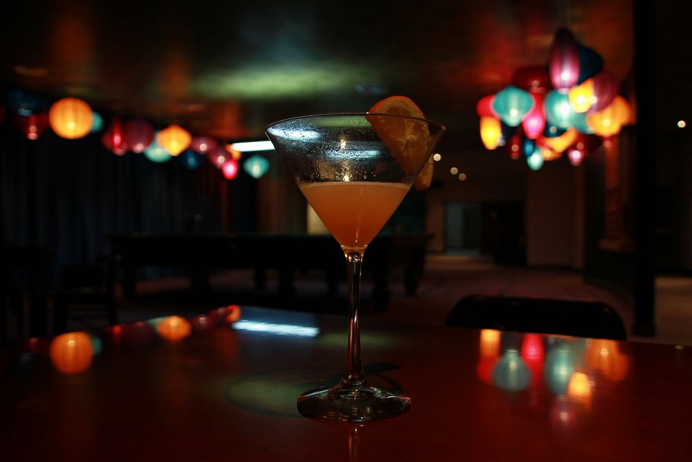 Free orange cocktail on bar counter