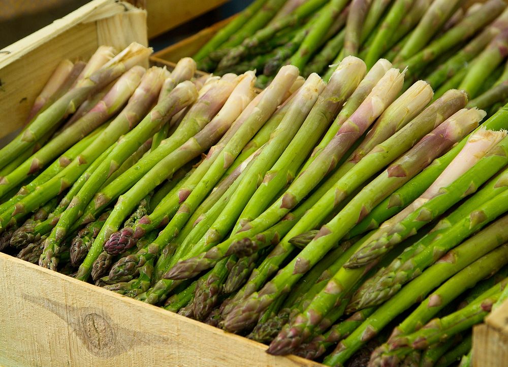 Free fresh pile of asparagus in boxes photo, public domain CC0 image.