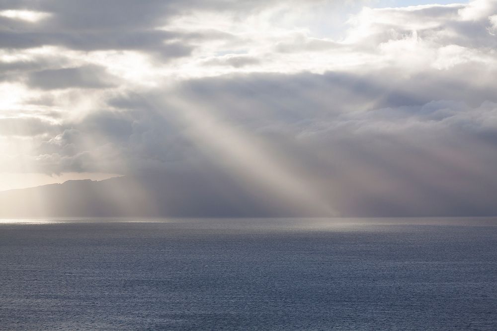 Free calm sea with beam of light coming out from the cloud image, public domain CC0 photo.