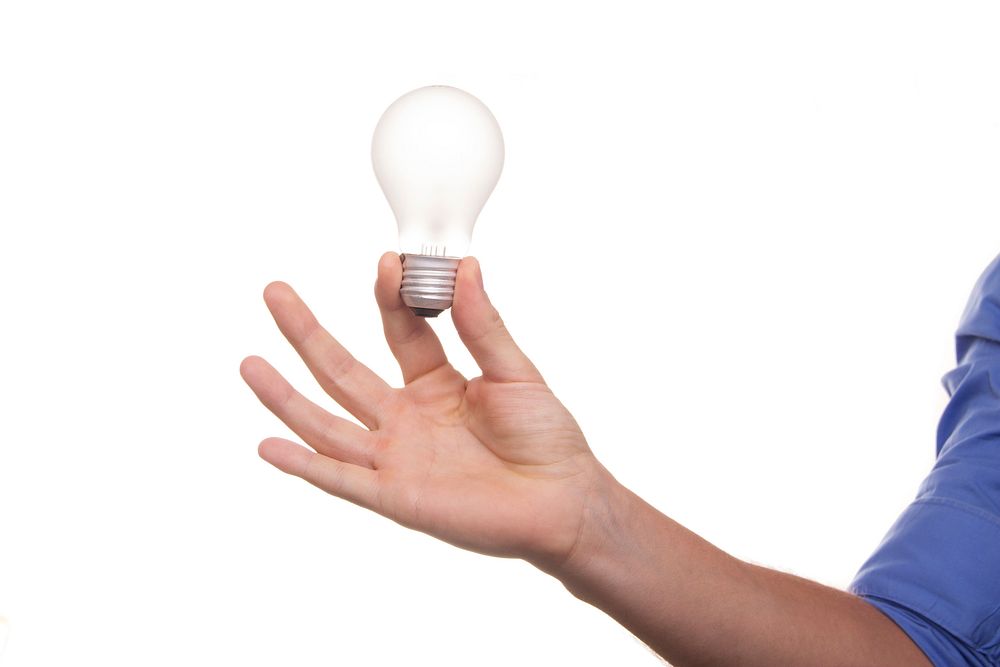 Free hand holding light bulb image, public domain ideas CC0 photo.