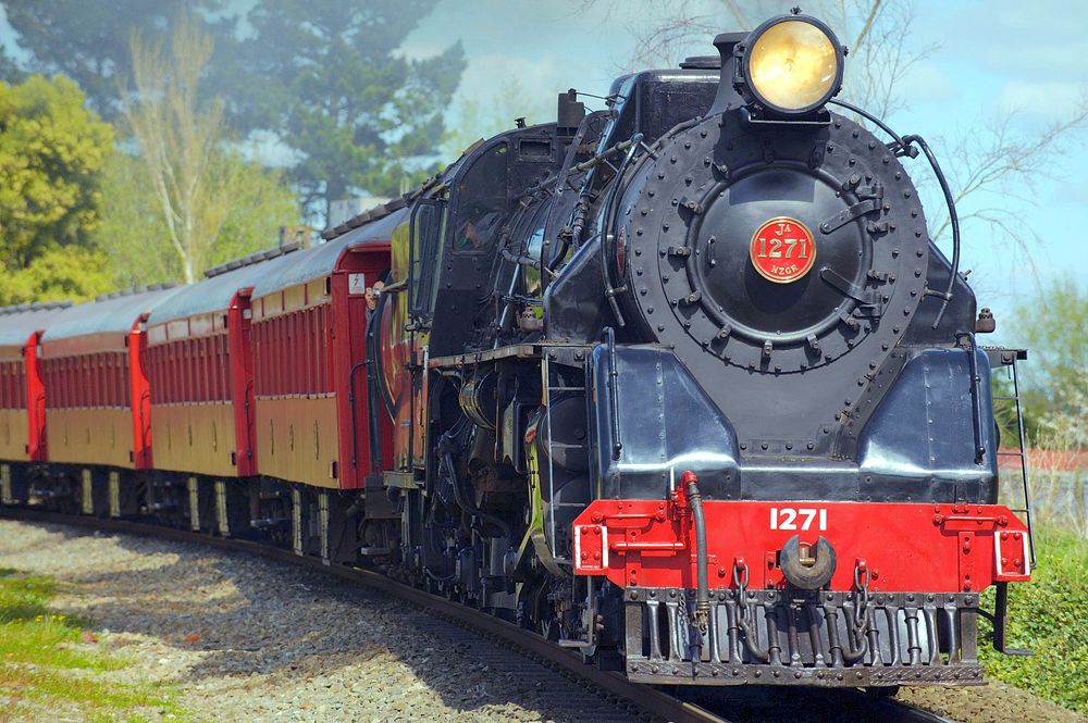 Train on railroad image, public domain CC0 photo.