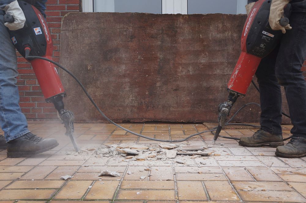 Free workers using drills on floor photo, public domain eqiupment CC0 image.