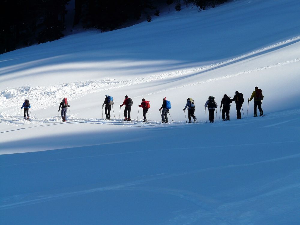 Free group of people hiking in snow mountain photo, public domain sport CC0 image.