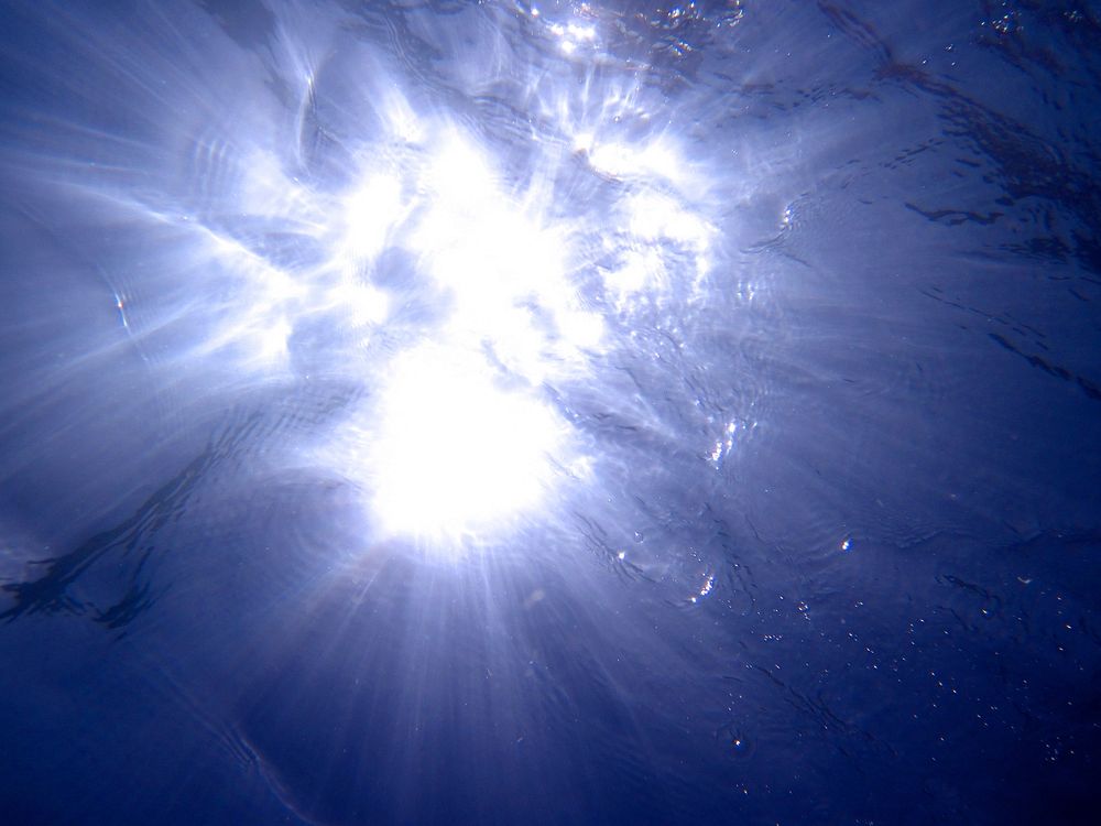 Water texture light beam photo, free public domain CC0 image.