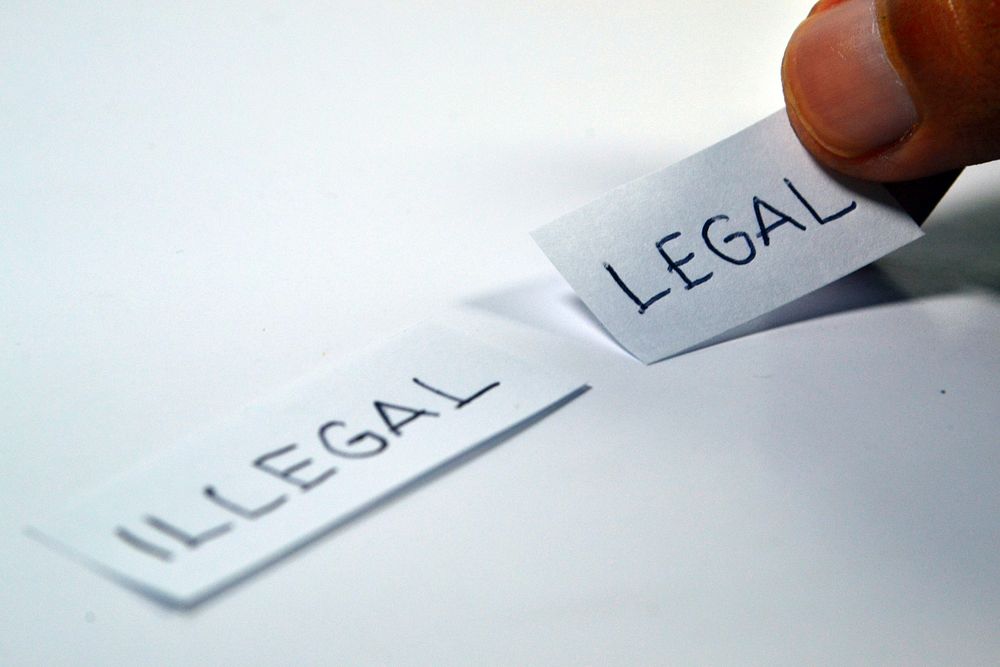 Free illegal & legal written on a piece of paper public domain CC0 photo.