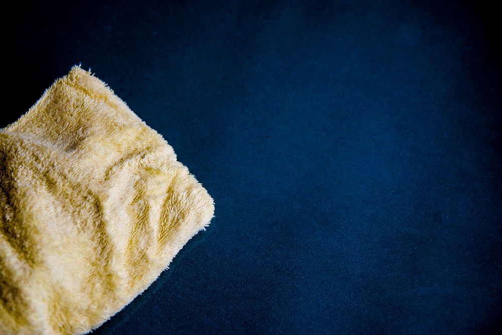 Free close up cleaning towel with blue background image, public domain tool CC0 photo.