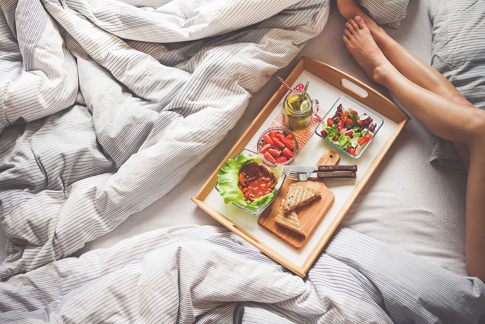 Free woman with breakfast in bed image, public domain CC0 photo.