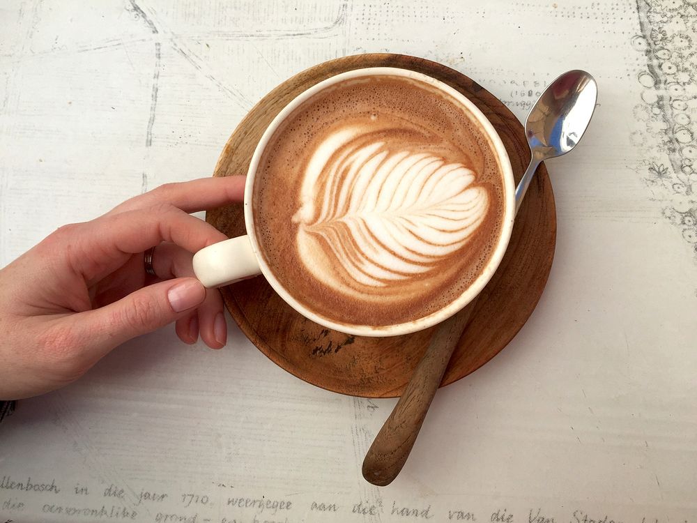 Free coffee latte art table top view photo, public domain beverage CC0 image. 