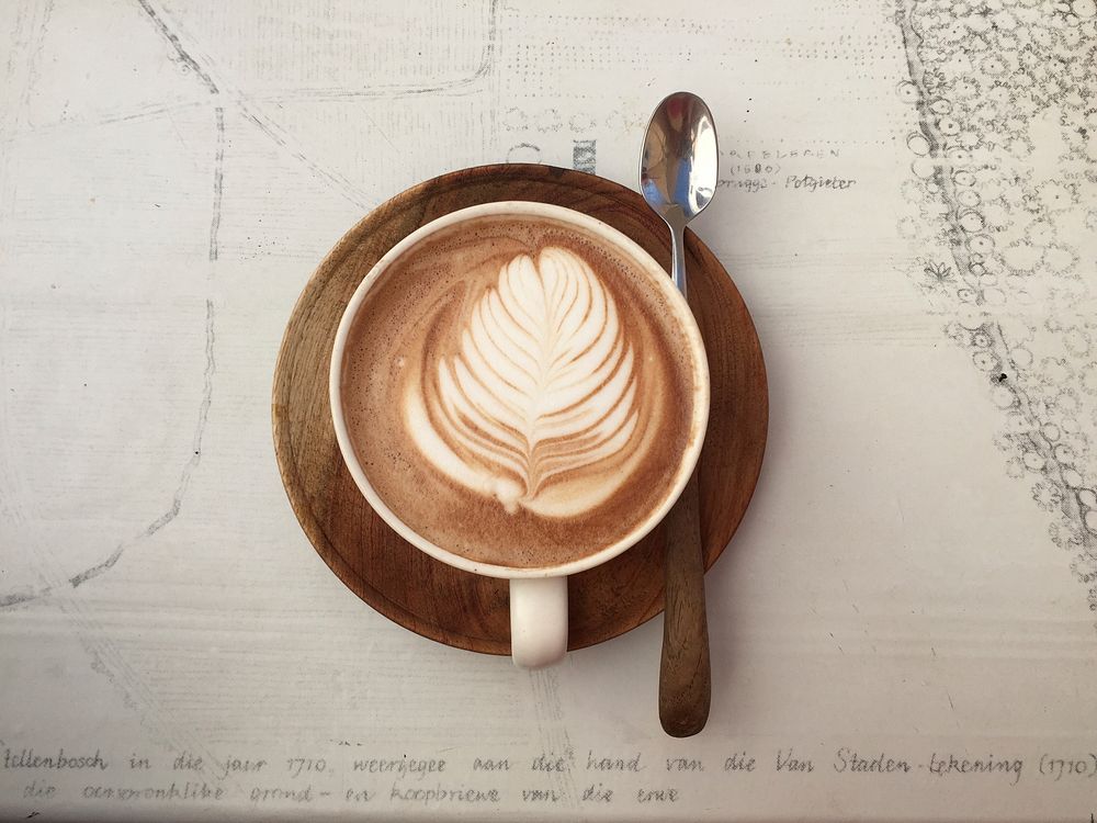 Free coffee latte art table top view photo, public domain beverage CC0 image.