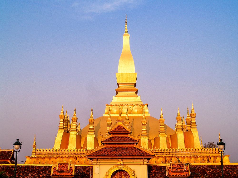 Golden pagoda with blue sky background, free public domain CC0 photo.