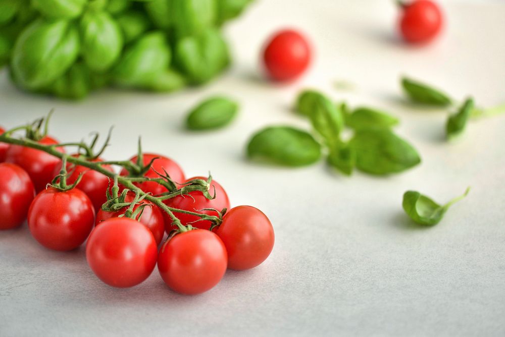 Free cherry tomatoes with basil leaves image, public domain CC0 photo.