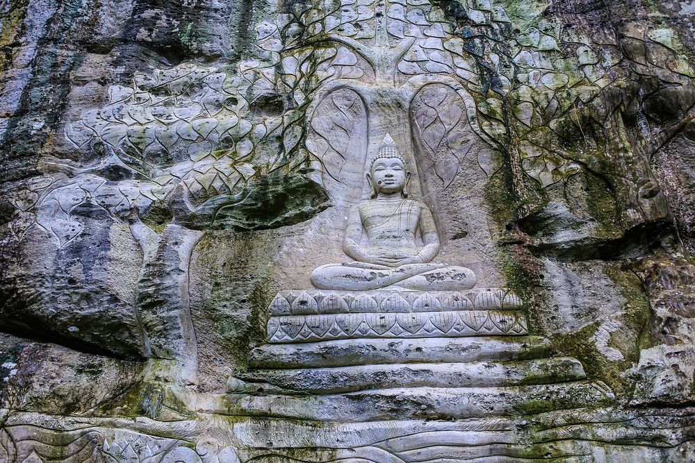 Stone carving buddha temple, wall art photo, free public domain CC0 image.