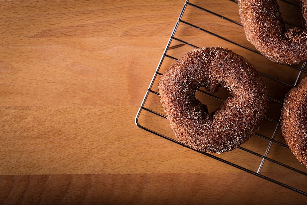 Free brown donut with heart hole image, public domain food CC0 photo.