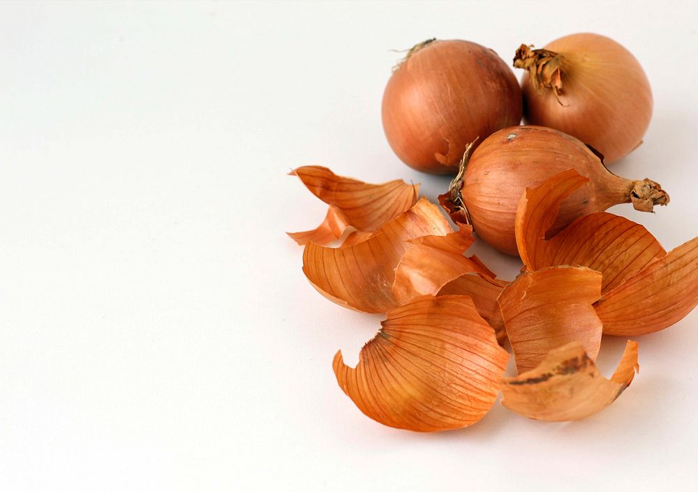 Free yellow onions on white table photo, public domain food CC0 image.