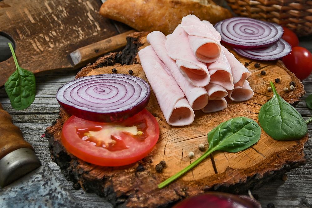 Free ham and slice of onion and tomato on wooden board image, public domain food CC0 photo.