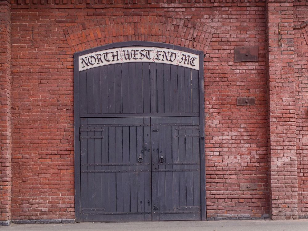 Free brick wall with wooden door image, public domain architecture CC0 photo.
