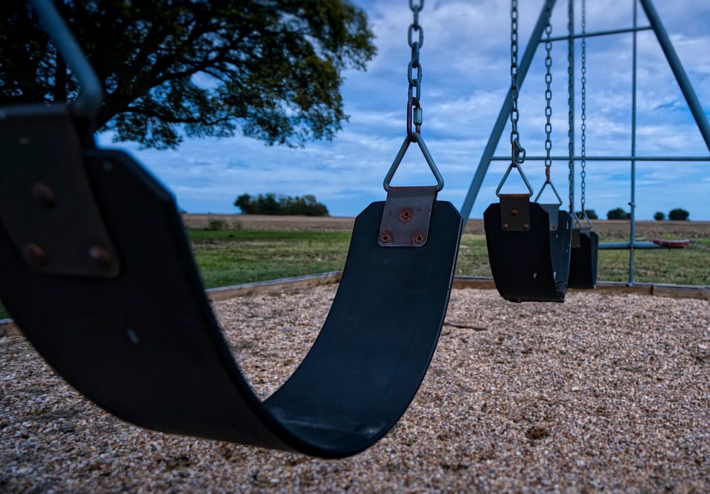 Swing in playground. Free public domain CC0 image.