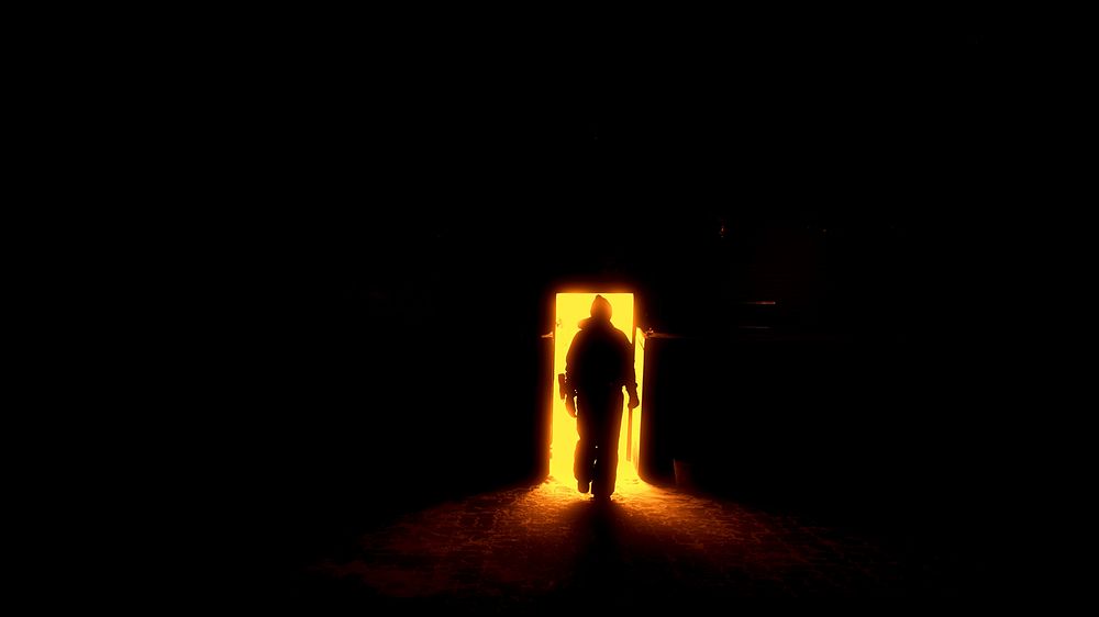 Free man's silhouette entering a dark room image, public domain CC0 photo.