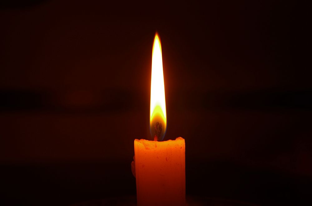 Free candle light fire in dark background photo, public domain CC0 image.