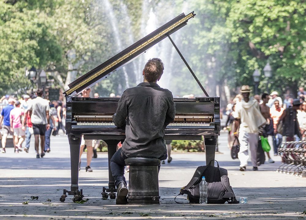 Man playing piano in public image, public domain musician CC0 photo.