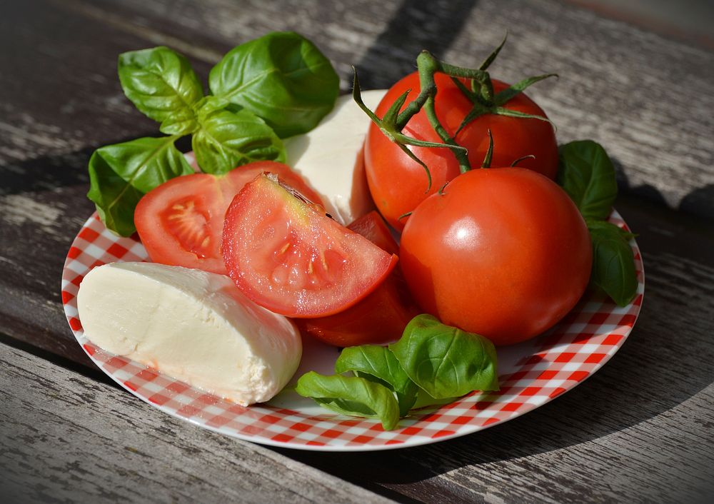 Free preparing tomato and mozzarella salad photo, public domain CC0 image.