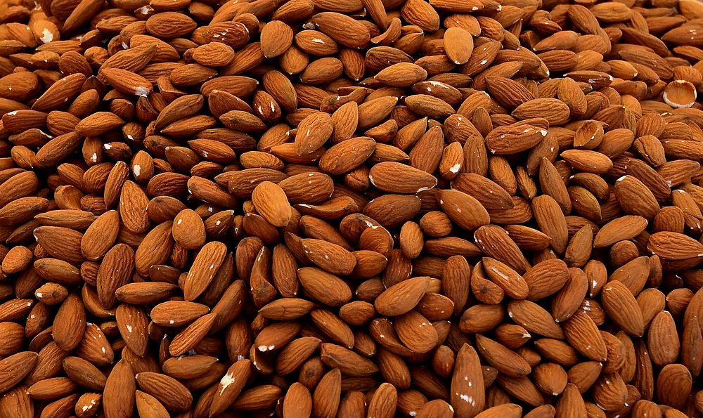 Free pile of almonds background public domain CC0 photo.