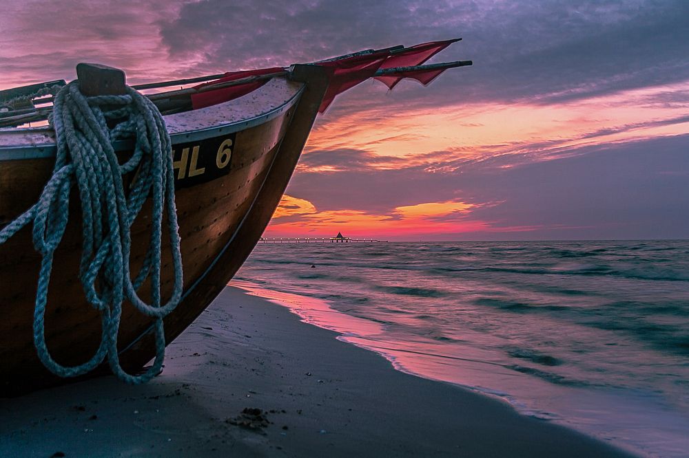 Free boat on shore at sunset image, public domain CC0 photo.