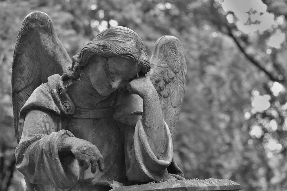 Free sad angel image, public domain gray background CC0 photo.