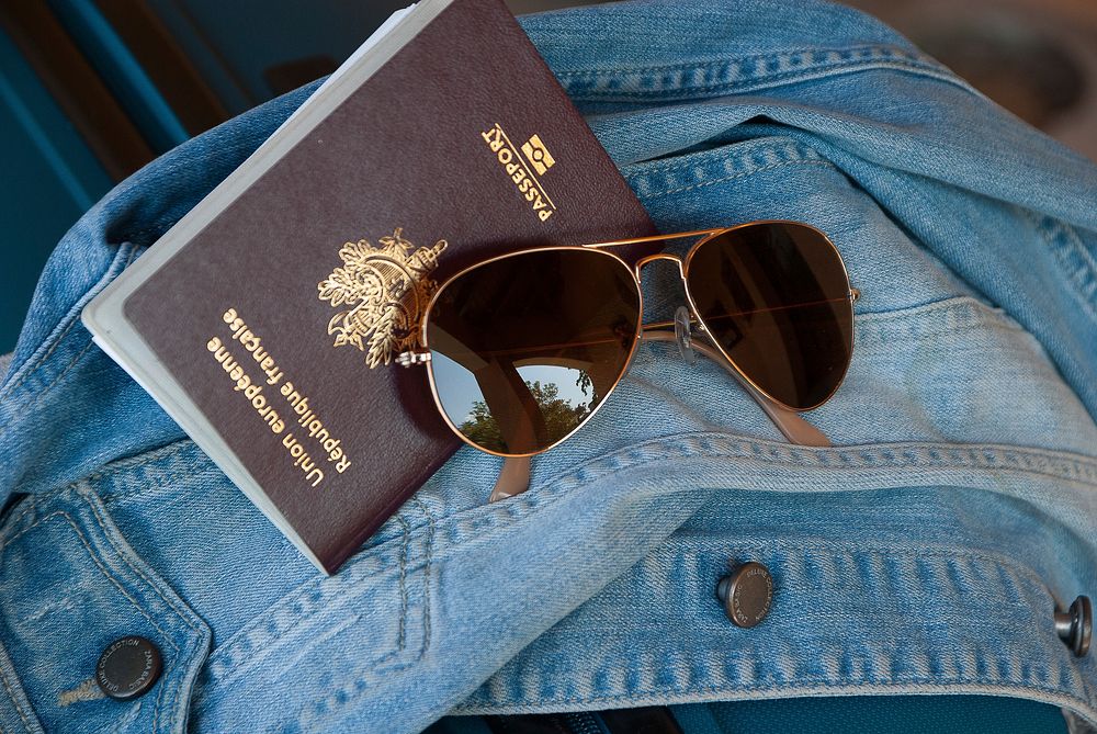 Passport and sunglasses, free public domain CC0 image.