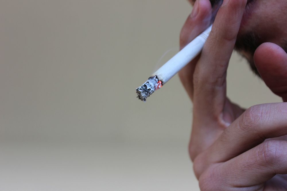 Free person smoking a cigarette photo, public domain CC0 image.
