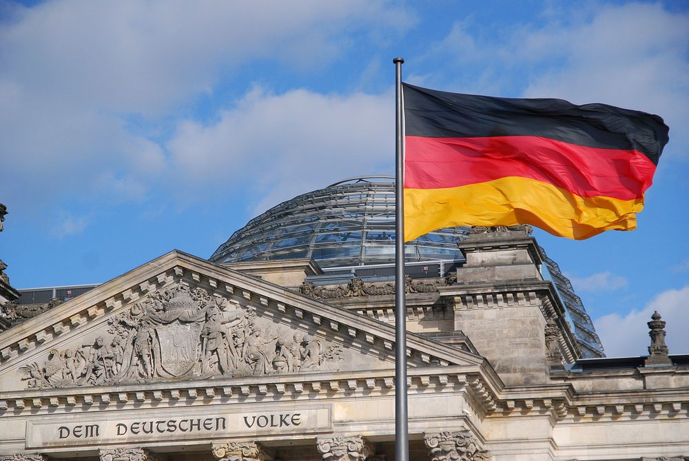 Free German flag waving in sky image, public domain CC0 photo.