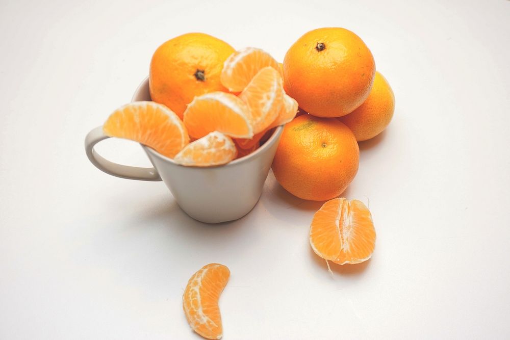 Free fresh oranges in white mug image, public domain fruit CC0 photo.