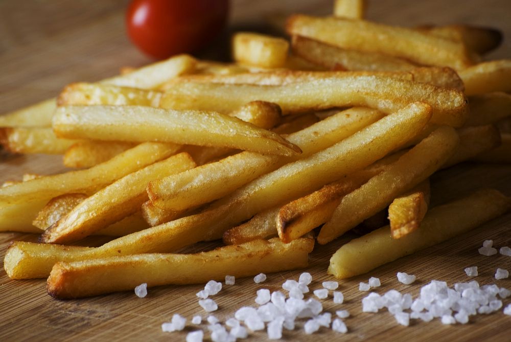 Free close up fries with salt wooden board image, public domain food CC0 photo.