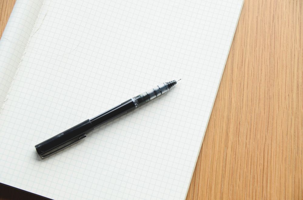 Free notebook and pen on table image, public domain design CC0 photo.