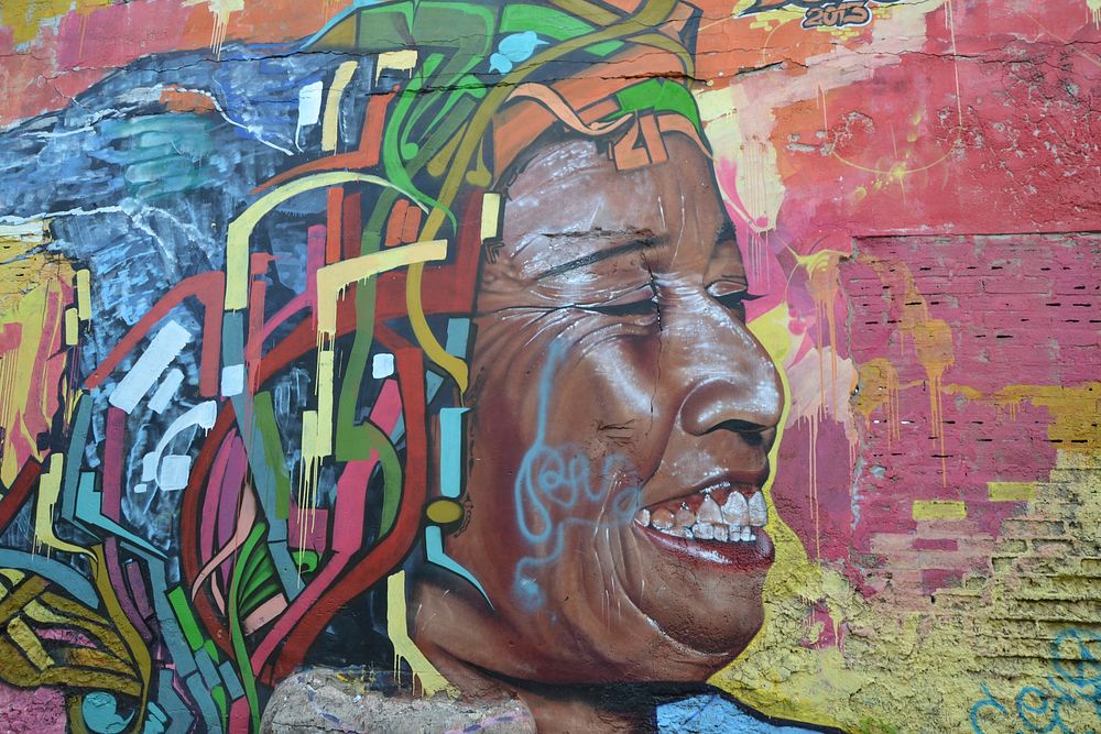 Colorful woman street art graffiti. Columbia, South America - 02/20/2017