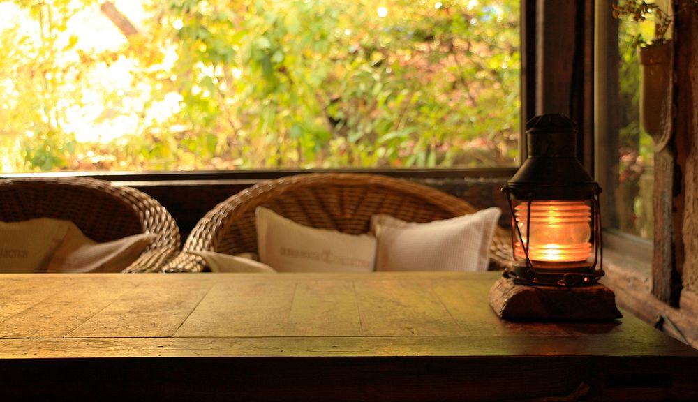 Free lit lantern on wooden table image, public domain CC0 photo.