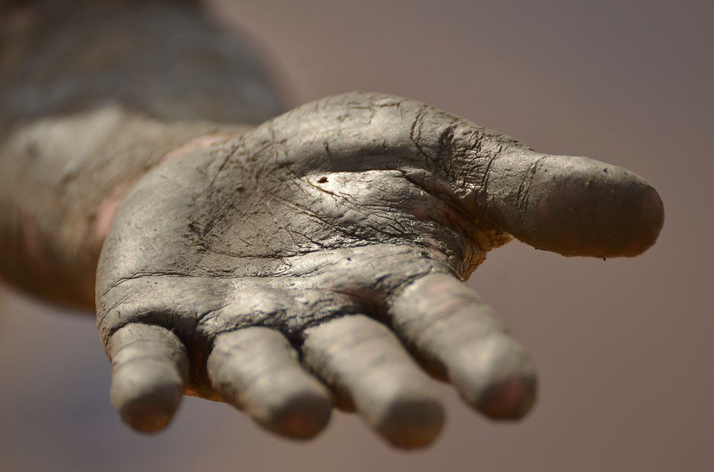 Free hand with dirt photo, public domain human CC0 image.
